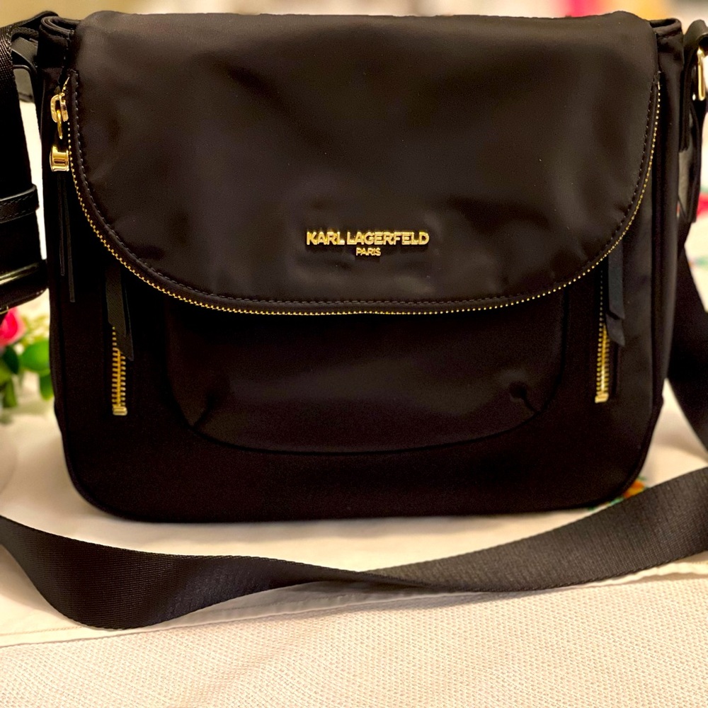 Karl Lagerfeld Crossbody with luggage strap purse. Shiny gold trim.  Super cute!